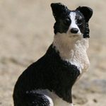 Kis ülő border collie figura